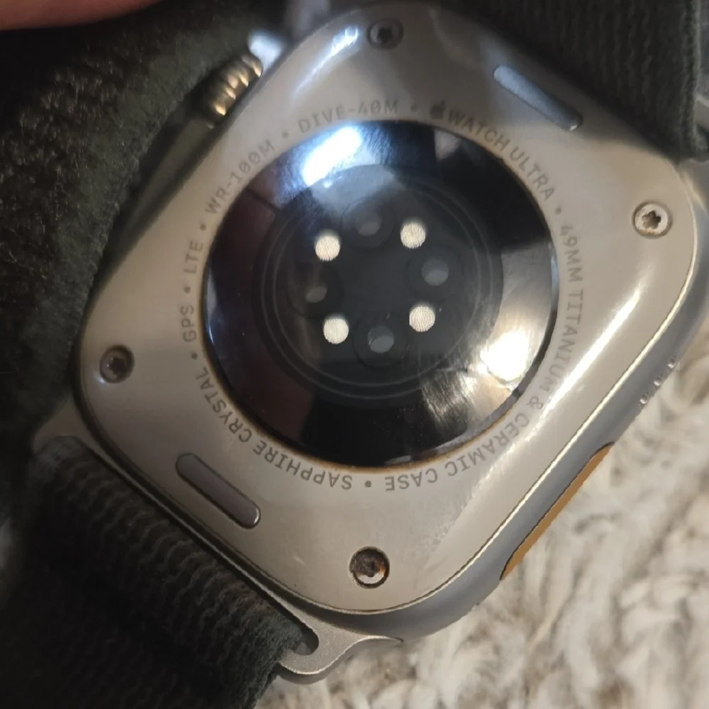 Advanced Smartwatch with Black Strap and Charger